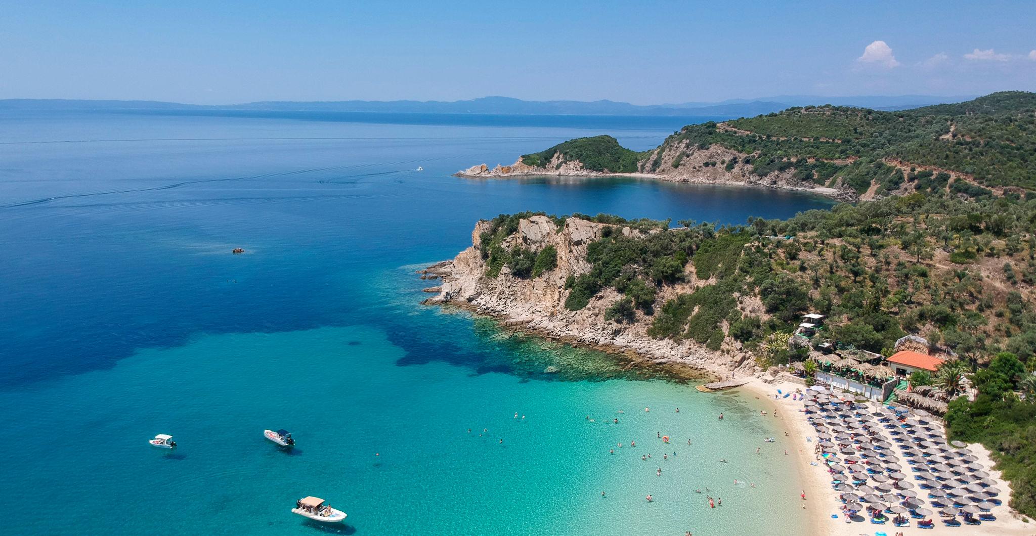 Sailing yacht anchored in a turquoise Greek bay