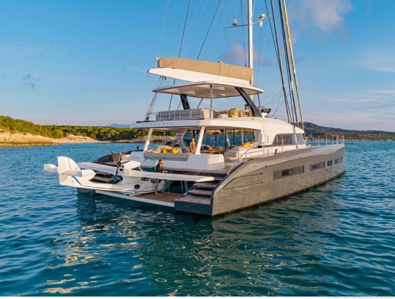 Catamaran anchored in a turquoise Greek bay