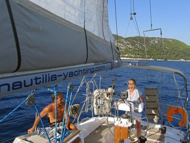 Sailing yacht under sail off a Greek island